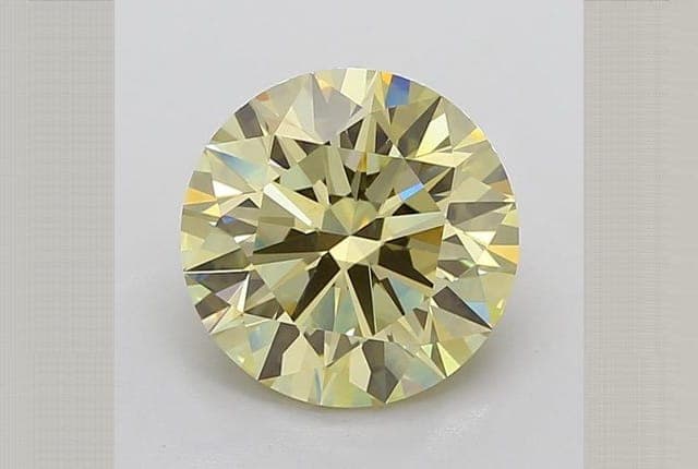 IGI | 6.36ct | Round | FANCY | VS1 | Ideal